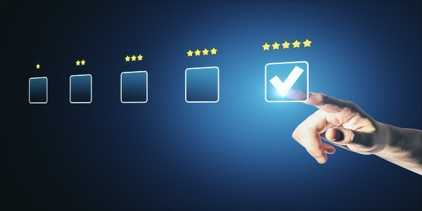 Hand selecting a top-rated option, representing a checklist for choosing the right loyalty platform provider.