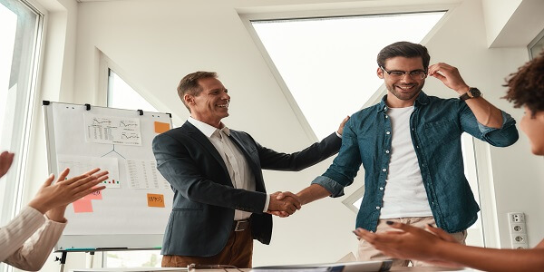 Leader congratulating employee to build trust and loyalty