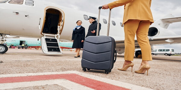 Business traveler boarding flight with airline loyalty benefits