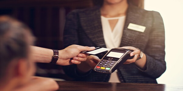 Customer paying with card, highlighting bank loyalty experience