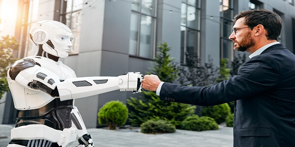 Businessman and robot fist bump symbolizing AI-driven trust and customer loyalty.