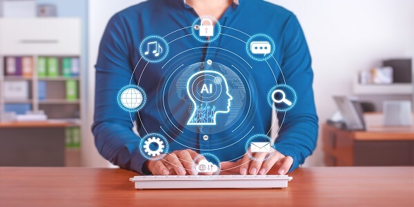 Person using a keyboard with digital AI icons around a human head graphic, symbolizing artificial intelligence in customer understanding and retention.