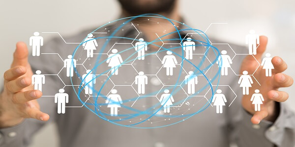 Business person visualizing a connected network of people, symbolizing customer referrals and influencer-driven loyalty programs.