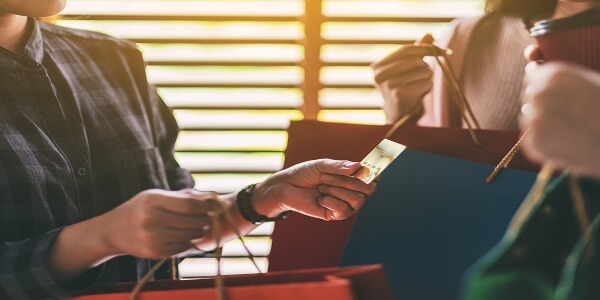 Customers enjoying benefits of tiered loyalty programs with premium membership rewards